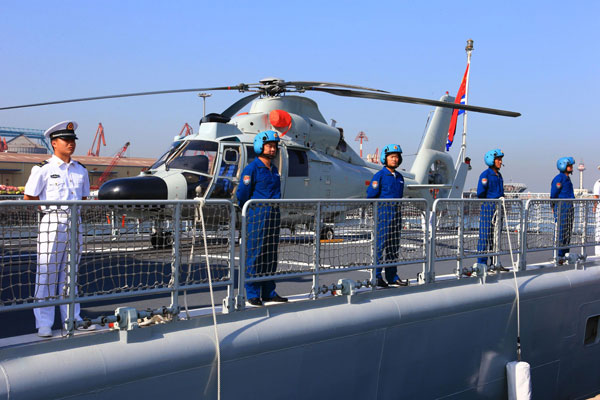 Crew members of the shipboard helicopter, Aug 20, 2013.  Chinese navy to visit US, New Zealand, Australia