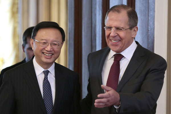 Russian Foreign Minister Sergey Lavrov escorts Chinese counterpart Yang Jiechi during their meeting in Moscow on Feb 22, 2013. President's Russia, S. Africa visits to boost relations