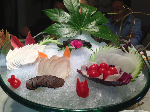 A sashimi selection of local mushrooms and herbs is presented on a mountain of crushed ice, featuring the truffle and its cousin. A new mountain treasure