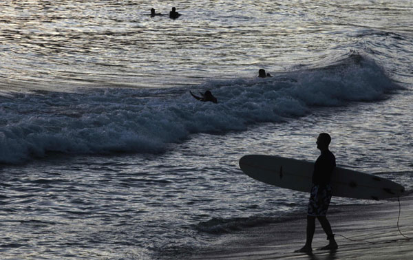 Surfer takes to the water in Rio de Janeiro Surfer takes to the water in Rio de Janeiro